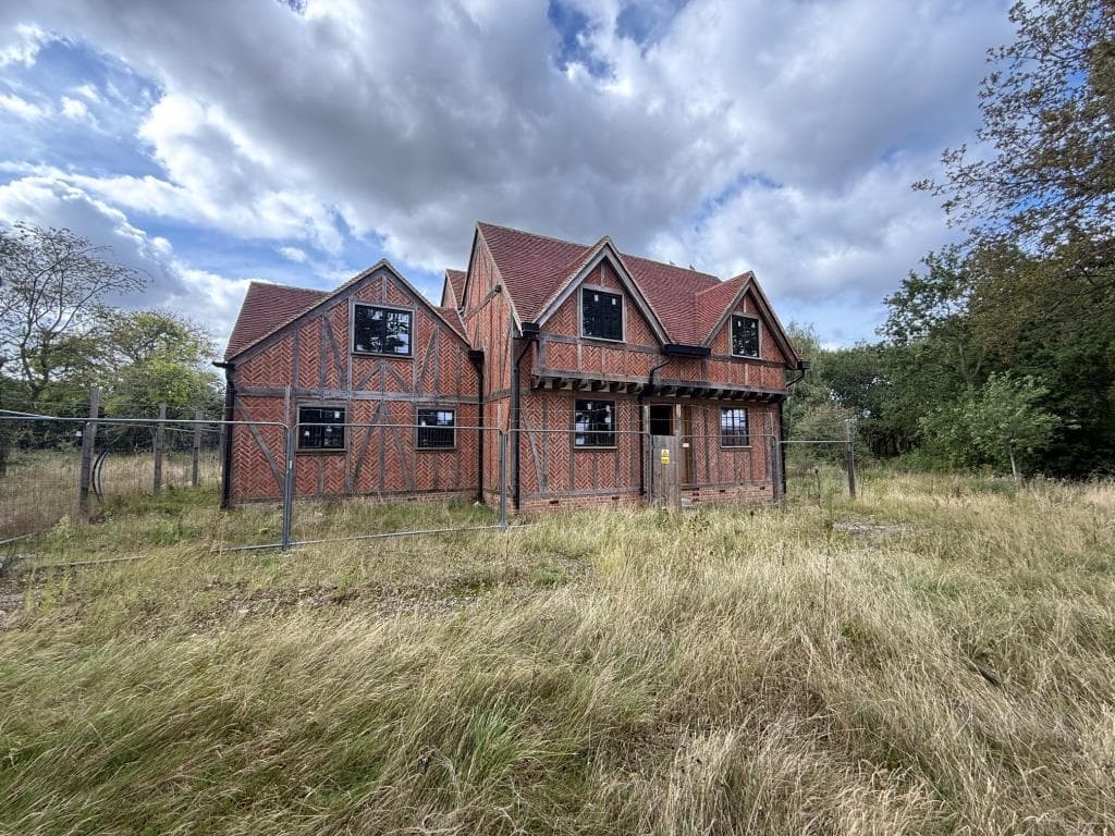 TUDOR STYLE HOUSE IN NEED OF COMPLETION OCCUPYING OVER TWO ACRES — photo 1